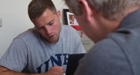 Student and professor working together