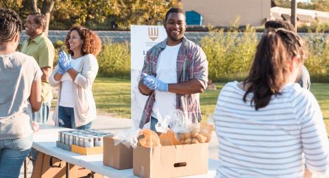 Group of people helping to hand out food