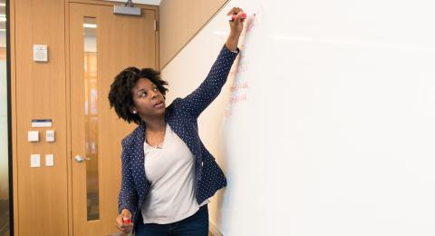 Student at white board