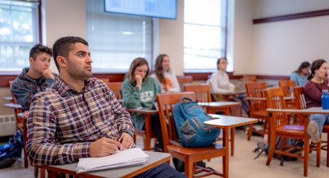 Students sitting at desks facing front of class