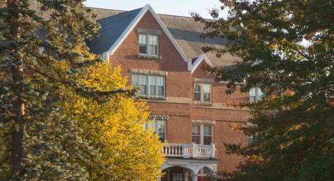 Smith Hall hidden behind trees