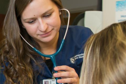 nurse using stethoscope