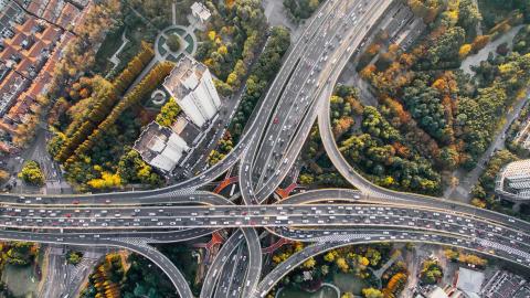 Aerial view of city roads intersecting with the environment
