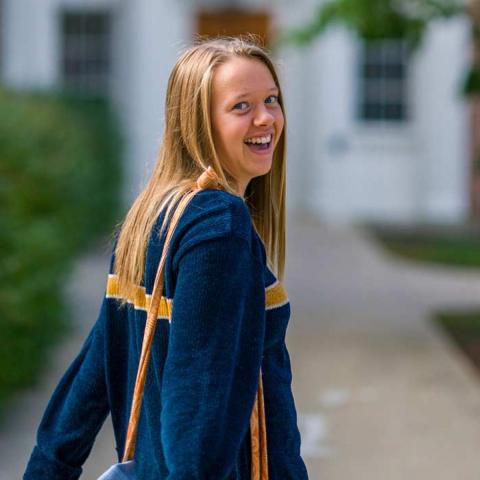 Student looking back at camera smiling