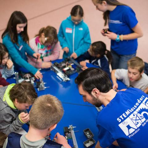 CEPS Stembassadors working with children on a robot